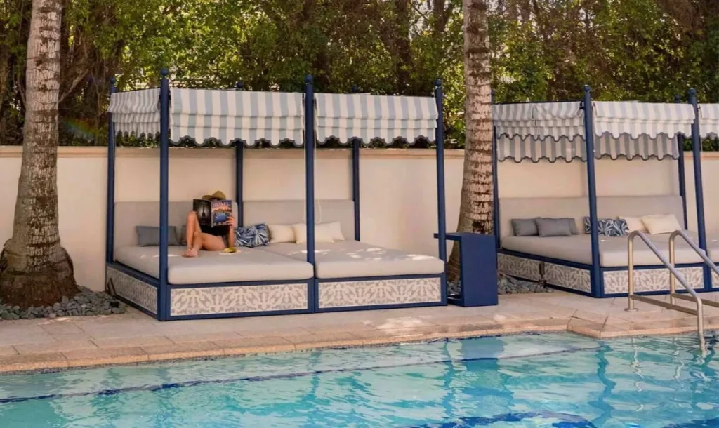woman reading in cabana at The Seagate